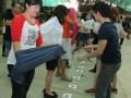 Fastest Time To Pass 10 T-shirts Along A 100-People Chain