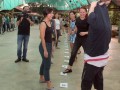 Fastest Time To Pass 10 T-shirts Along A 100-People Chain
