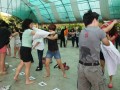 Fastest Time To Pass 10 T-shirts Along A 100-People Chain
