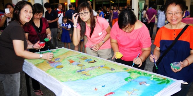 Most Number of People Painting On A Chinese Lantern