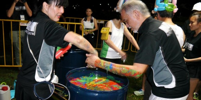 Most Number Of People Running With Painted Arms