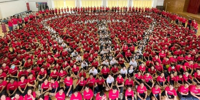 Largest Human Formation Of A Superhero Logo