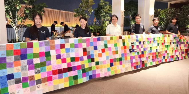 Largest Banner Covered In Fabric Pieces With Handwritten Notes