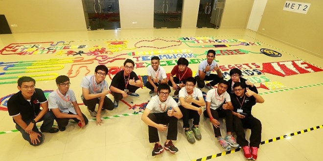 Most Dominoes Toppled In A Set-up Made By A Group